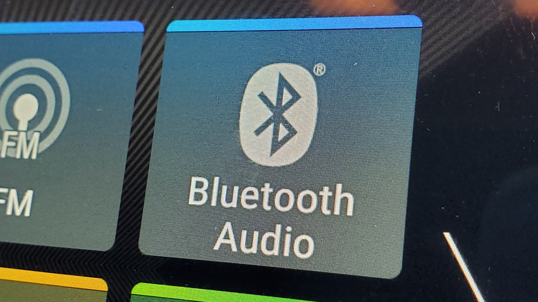 Close-up on a vehicle infotainment system displaying an option for Bluetooth audio.