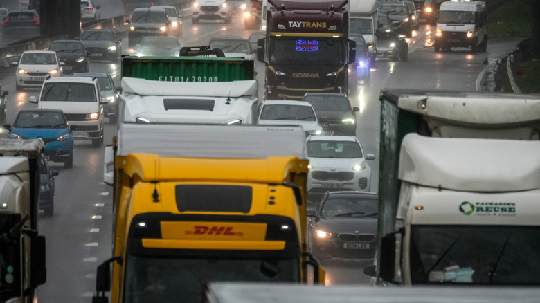 a busy highway with trucks and cars on it