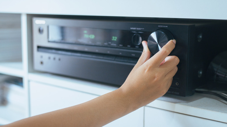 A hand tuning a receiver