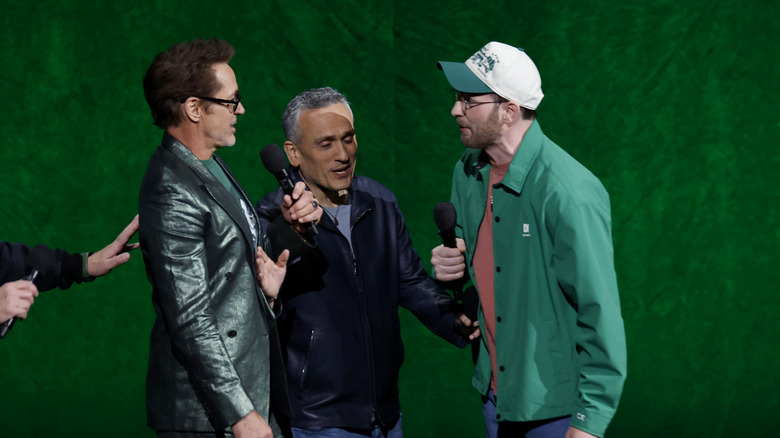 Robert Downey Jr., Joe Russon, and Chris Evans promoting Avengers: Doomsday at CinemaCon 2026.