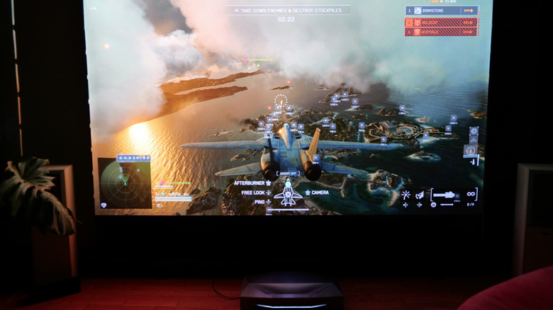 Battlefield 6 running on the PS5, connected to the Aetherion Max projector and 120 inch floor rise screen