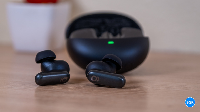 Baseus Inspire XP1 earbuds and case on a table