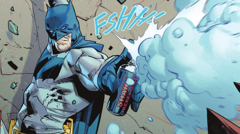 Batman spraying the Shark Repellent
