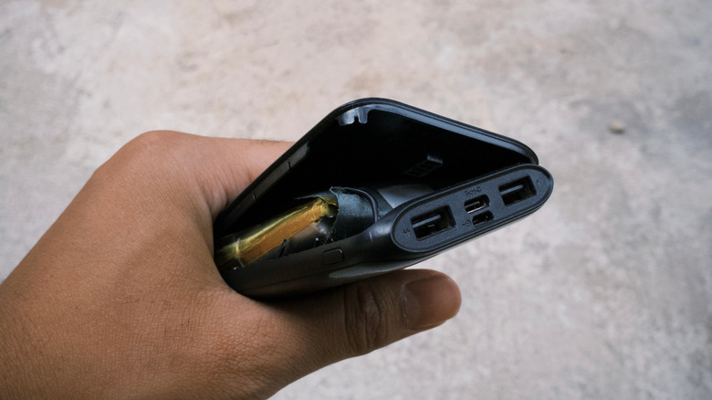 swollen battery in a power bank showing the dangers of battery swelling