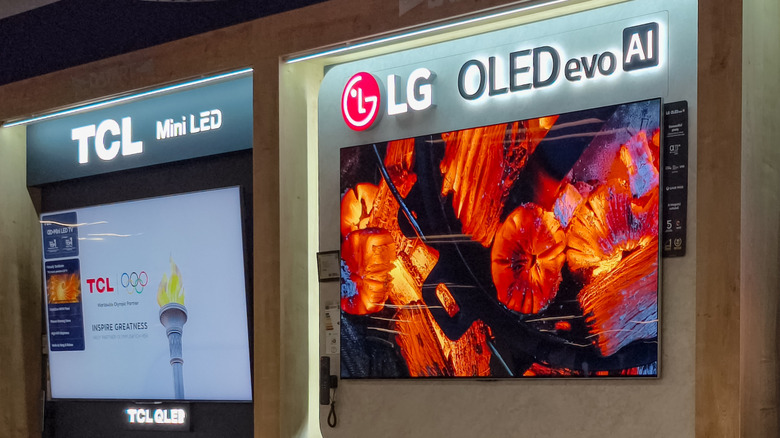 LG and TCL smart TVs on display in a retail setting