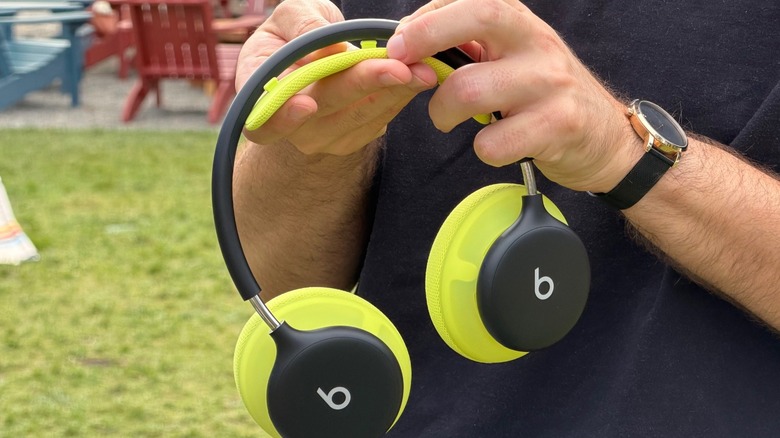 A man detaching Beats 360 headphones headband