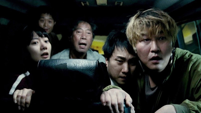 A group of characters looking scared in Bong Joon Ho's The Host