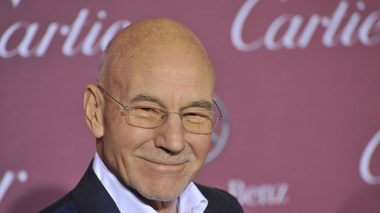 Patrick Stewart at a meetup wearing glasses
