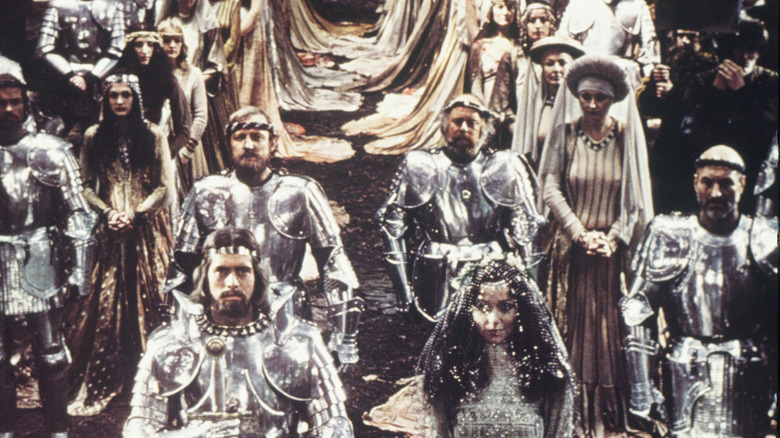 Still from the movie "Excalibur" with Patrick Stewart visible as Leondegrance in the far right