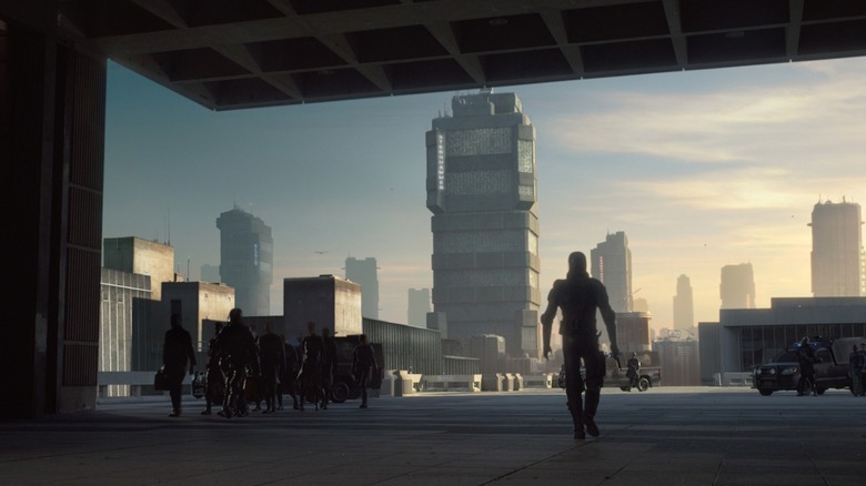 Dredd (Karl Urban) walking out to Mega City One in Dredd