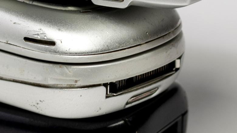 Motorola CE Bus connector seen on the bottom of a mobile phone in a stack