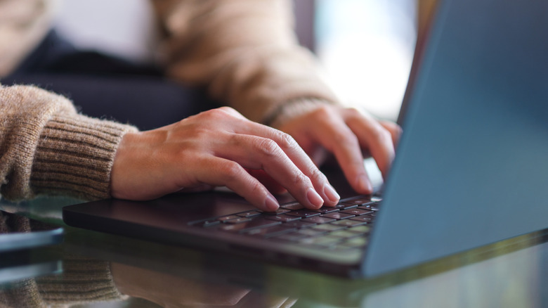 Person working on a laptop.