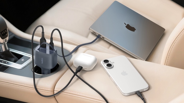 Belkin's new Retractable Car Charger charging a MacBook Pro, AirPods 4, and an iPhone 16
