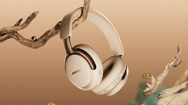 Bose QuietComfort Ultra Headphones (2nd Gen) hanging off a tree brand