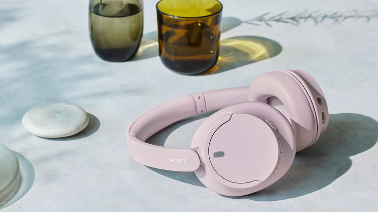 Pink Sony WH-CH720N headphones lying on a table