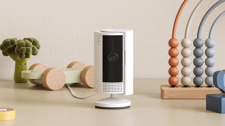 Security camera placed on a table along with other things