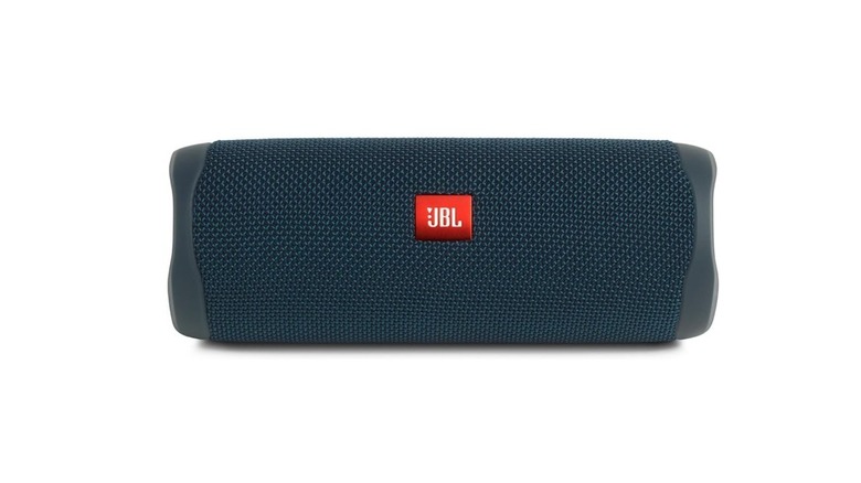 JBL speaker placed beside a pool