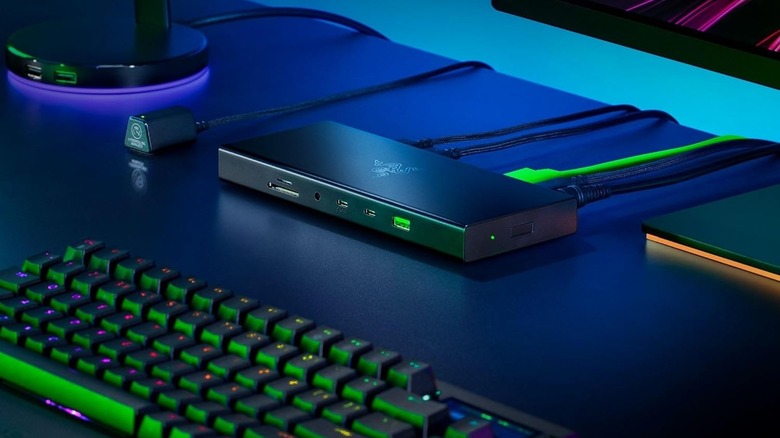 Razer USB4 Dock on a desktop as part of a gaming setup with RGB lights around