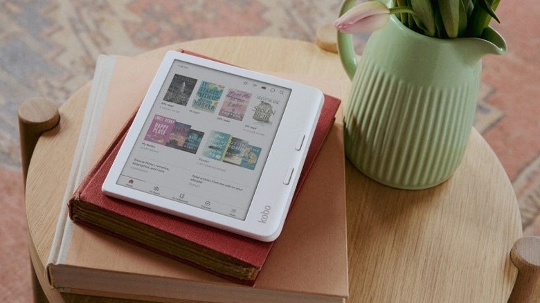 Kobo Libra Colour on a set of physical books