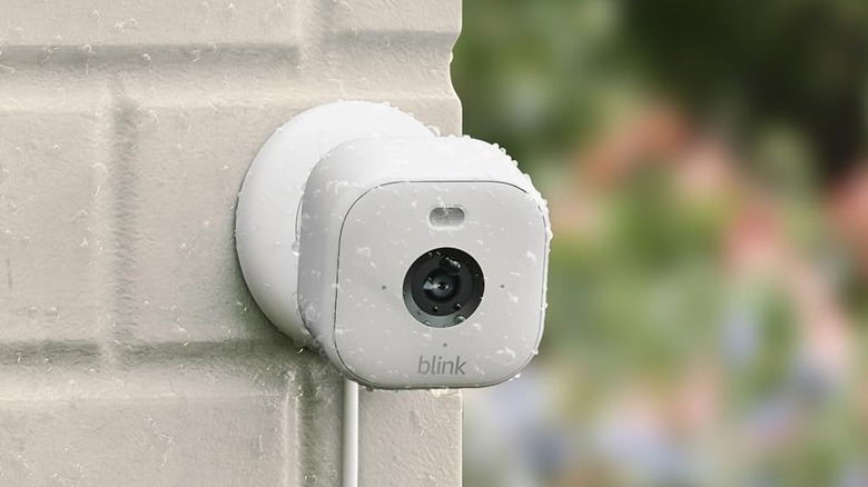 A Blink Mini 2 camera mounted on an exterior wall