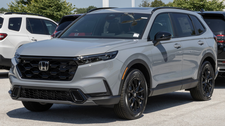 A grey Honda CR-V parked at a dealership