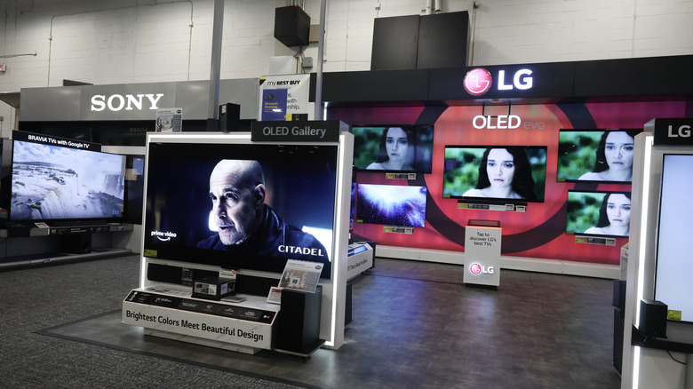 Sony and LG televisions are seen on a salesroom floor