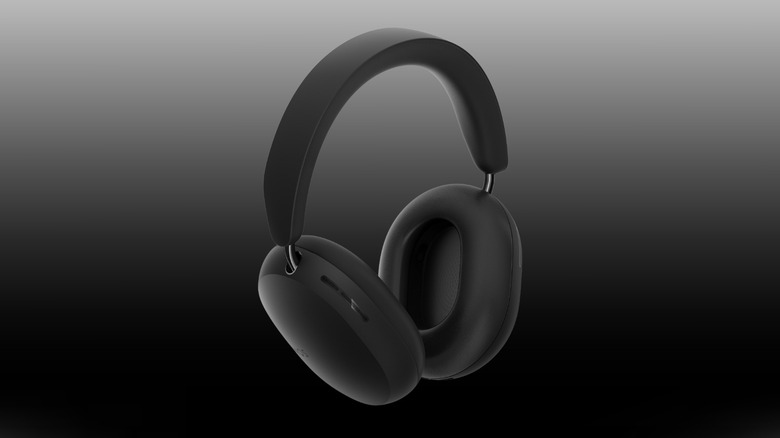 A pair of black Sonos Ace headphones on a black-to-white gradient background.
