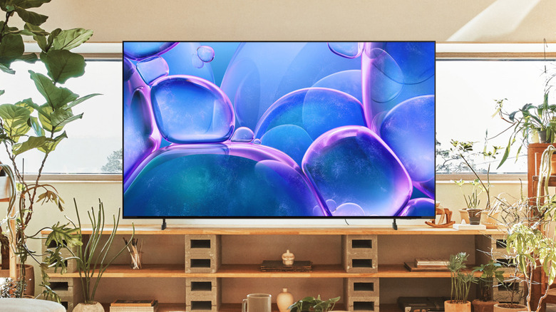 The Samsung U8000F placed in a living room with a lot of plants