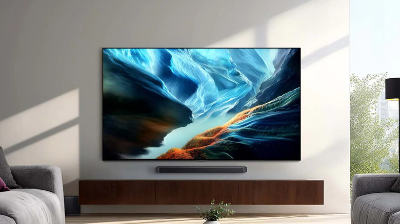 The Samsung OLED S90H wall-mounted in a living room