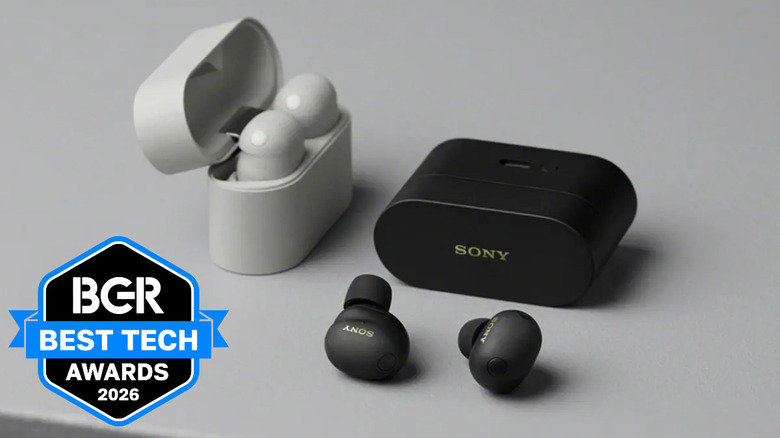 White and black Sony WF-1000XM6 earbuds sitting on a table.