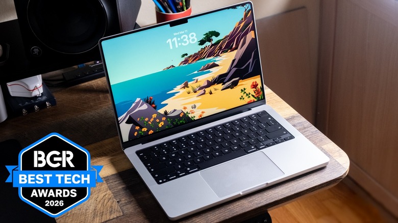 MacBook Pro sitting on the corner of a desk.