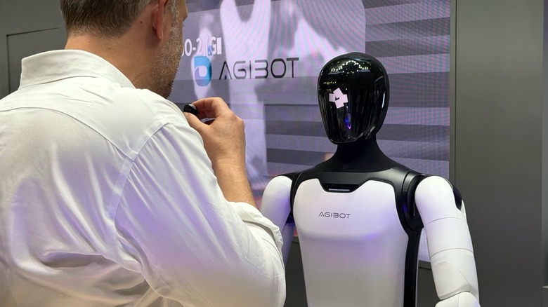 Man interacting with Agibot's robot