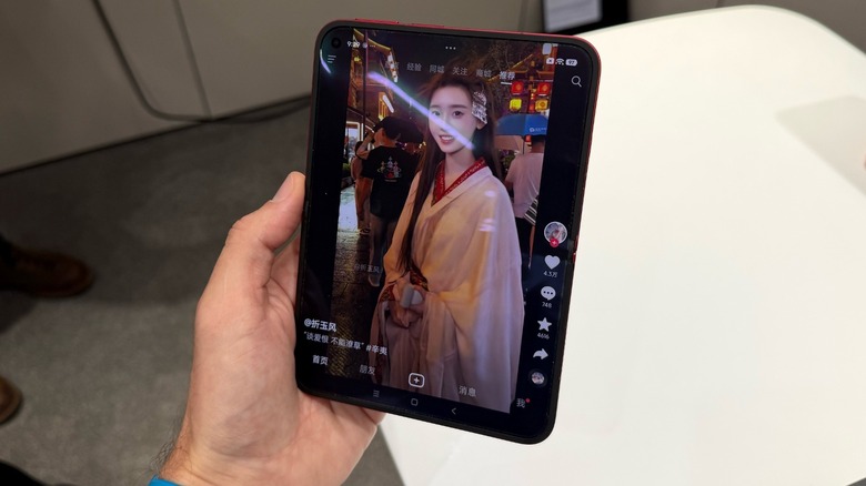 Close-up shot of foldable phone with TikTok open up
