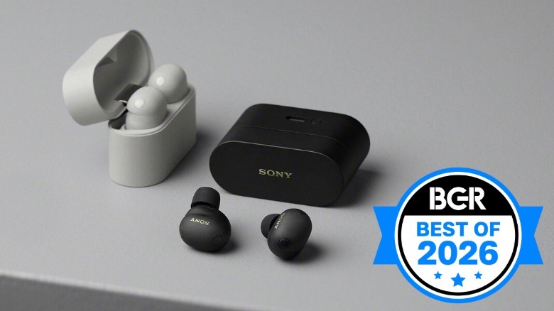 White and black Sony WF-1000XM6 earbuds sitting on a table.