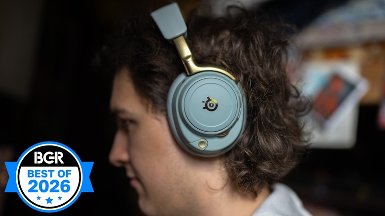 SteelSeries Arctis Nova Elite headphones sitting on a man's head.