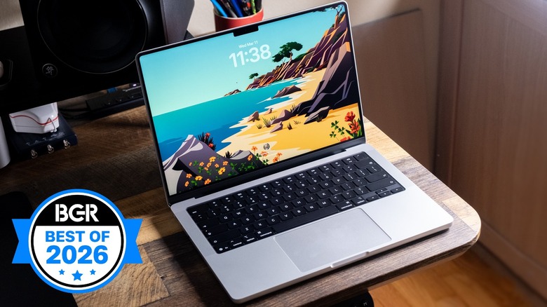 MacBook Pro sitting on the corner of a desk.