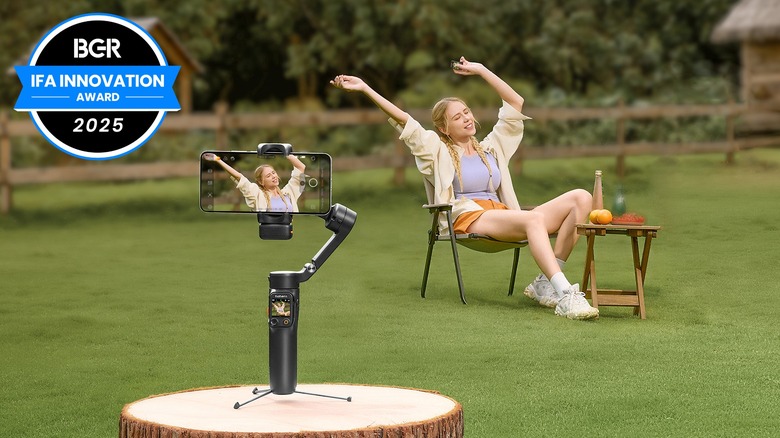 Hohem iSteady V3 Ultra with a phone filming a woman in a chair