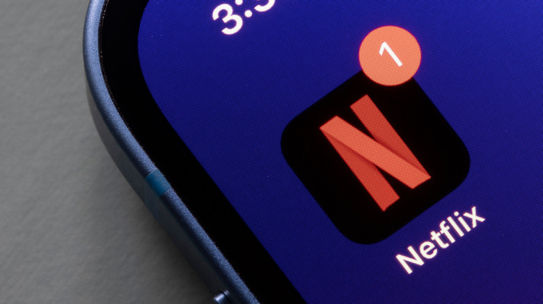 Closeup of the Netflix mobile app icon seen on an iPhone
