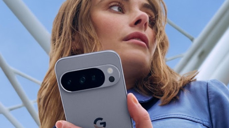 Woman looking around while using Google Pixel 10 smartphone