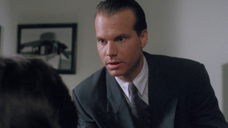 Bill Paxton leaning forward as he stares at someone off camera.