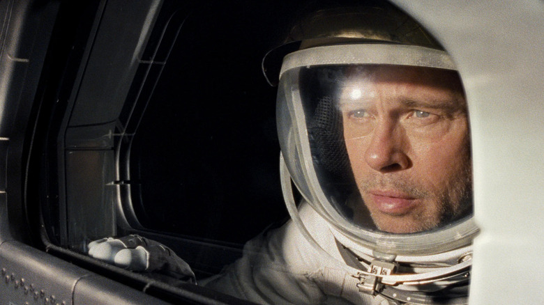 Roy (Brad Pitt) staring out of a window in 