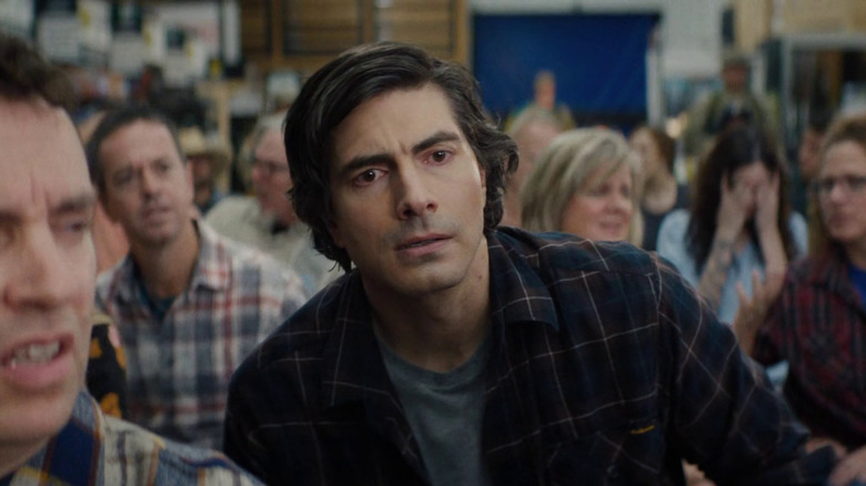 Hank looking worried at the town meeting