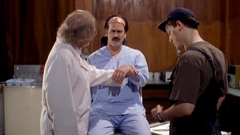 William (Bruce Campbell), Dr. Ivan (Stacy Keach), and Pavel (Ted Raimi) hanging out in "Man with the Screaming Brain."