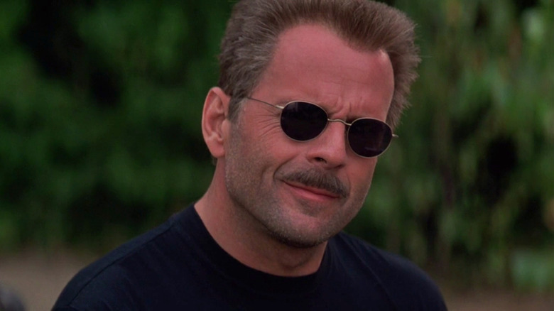 The Jackal wearing shades and a devilish smile