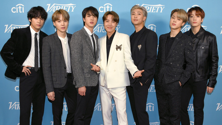 BTS members posing on red carpet in 2019