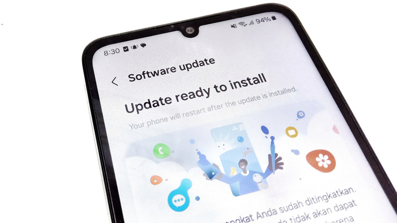 A Samsung Galaxy phone indicates that a software update is ready to install.