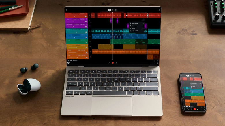 Googlebook laptop and smartphone showing a music editing project on a desk.