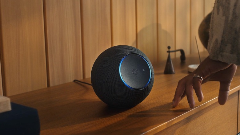 A man's hand near the new Amazon Echo Studio speaker