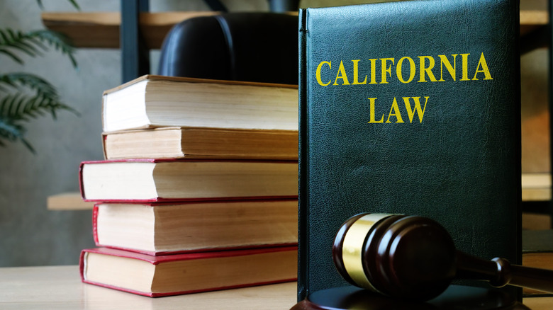 California Law book with gavel nearby and a stack of books behind.
