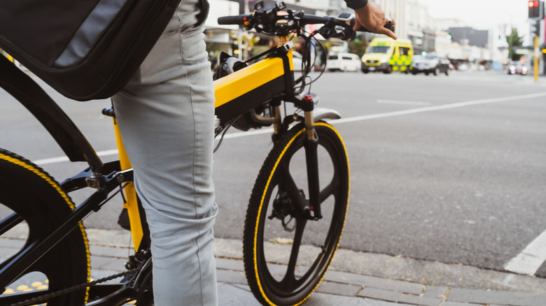 Person riding an e-bike on the road